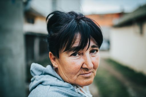 A shallow focus shot of a Caucasian female looking at the camera