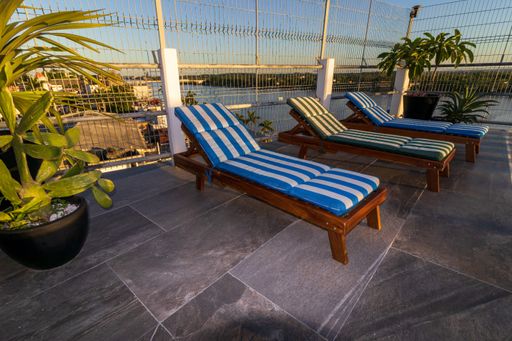 The sun loungers near the swimming pool
