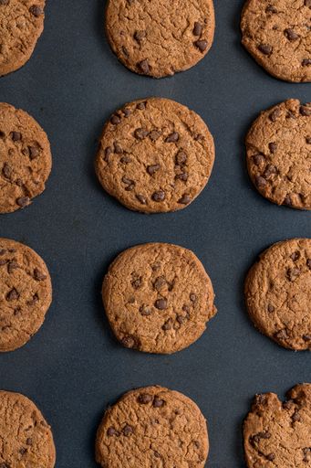 A top view of chocolate chip cookies on a baking pan