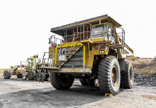 Witbank, South Africa - July 25 2011: Large Dump Trucks transporting Coal ore for processing