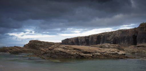 A beautiful rainy cloudscape over As Catedrais beach in Lugo, Spain