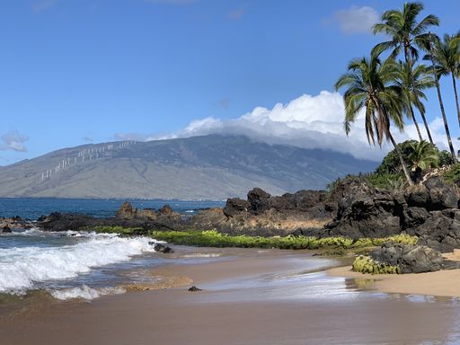 A beautiful shot of pacific ocean view with black volcanic rock beach on the Island of Maui, Hawaii