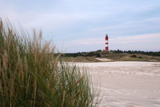 A beautiful view of the Wittduen lighthouse at sunset, Amrum, Germany