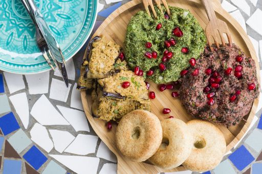 A top view of a Georgian traditional food Pkhali dish with vegetables and pomegranate seeds