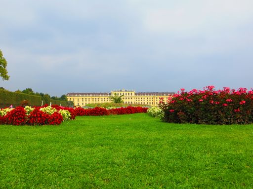 A wide angle shot of the Schönbrunner Schloss Park in Vienna , Austria during daytime