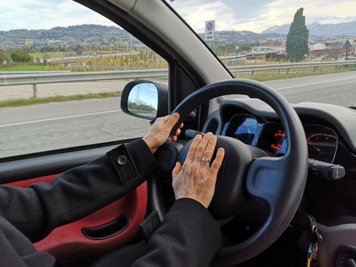 A closeup shot of a detail of a man driving his car