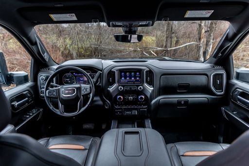 A black leather interior of a 2020 GMC Sierra 2500HD AT4 pickup truck