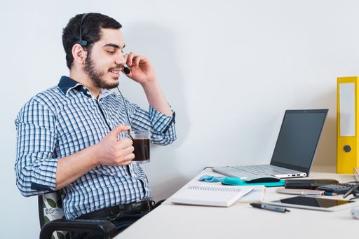 A male working through a video conference while working from him during the quarantine