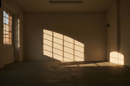 An interior shot of an empty room with white walls