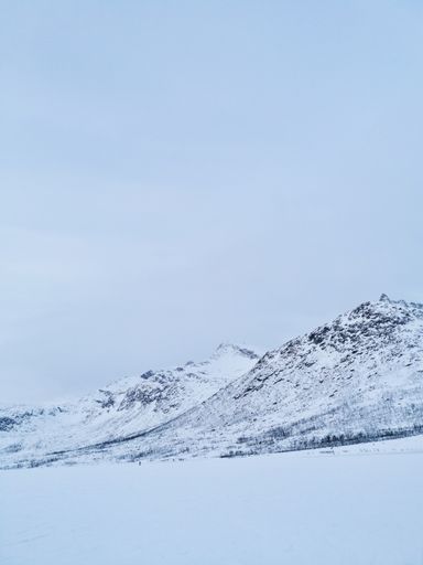 A beautiful Arctic landscape with the Kattfjordvatnet lake in Kvaloya Island, Norway during winter