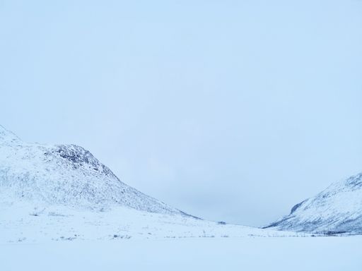 The beautiful view of snowy mountains in the Arctic, Kvaloya Island, Tromso, Norway