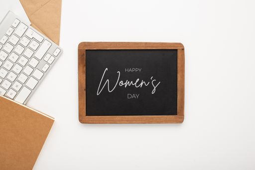 A closeup shot of a Women's day desk decoration set with text on it