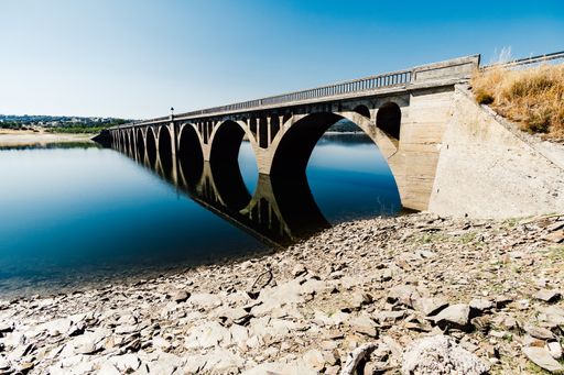 An old bridge over Santa Teresa Reservoir, Salamanca, Castile, Spain