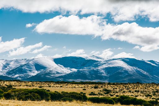 A mesmerizing view of the Sierra de Gredos mountain range under the cloudly blue sky in Spain