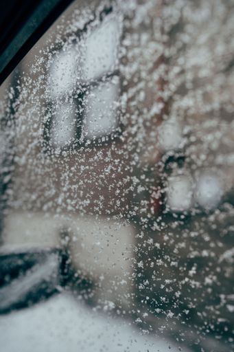 A car window with ice. Frosty morning commute.