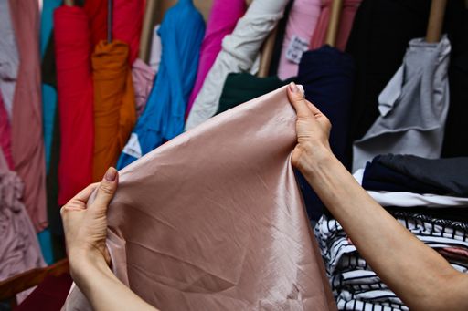 A closeup shot of a colorful fabric section in an outdoor market