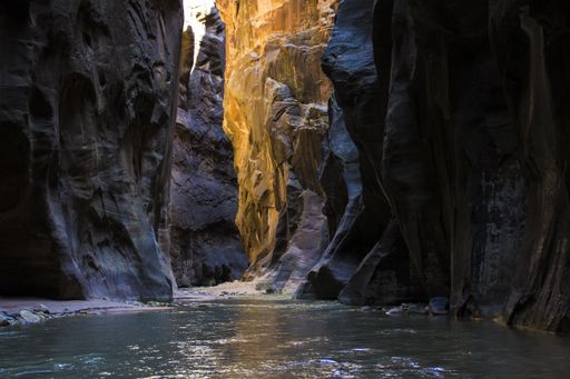 A beautiful shot of a water stream in the middle of the mountains