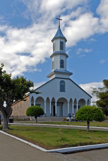 A vertical shot of a church touching the sky in Chile