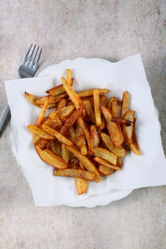 A vertical shot of homemade fried potatoes