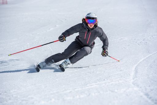 Grau Roig, Andorra : 2021 January 28 : Young  woman skiing on a sunny day in Andorra.