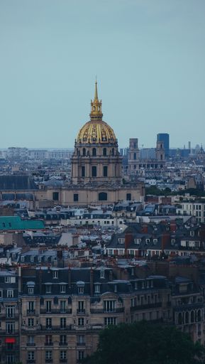 A vertical shot of the Tomb of Napoleon Bonaparte with the city in the background, Paris, France