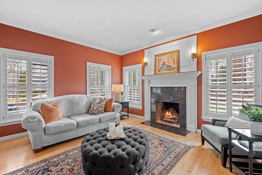 A closeup shot of the interior of a modern living room with a fireplace