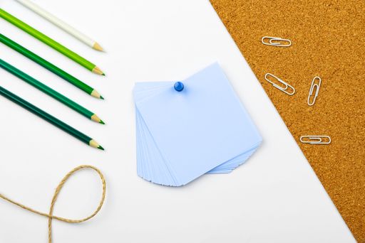 This is a stock photo of a table with several colored pencils on it