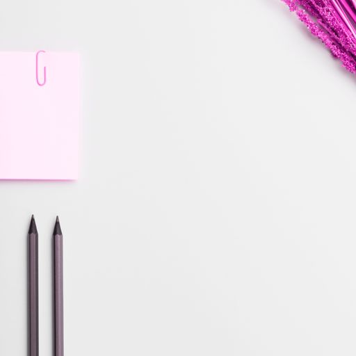 This is a stock photo of a notebook paper and a pencil on a white background