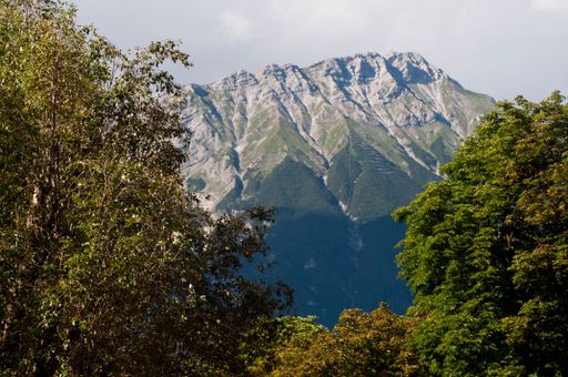 A picturesque view of the Innsbruck mountains on a sunny summer's day