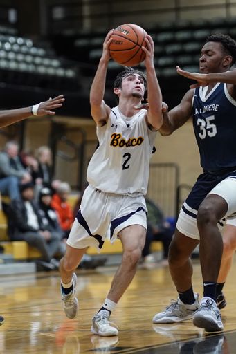 Basketball players in a gym during a game