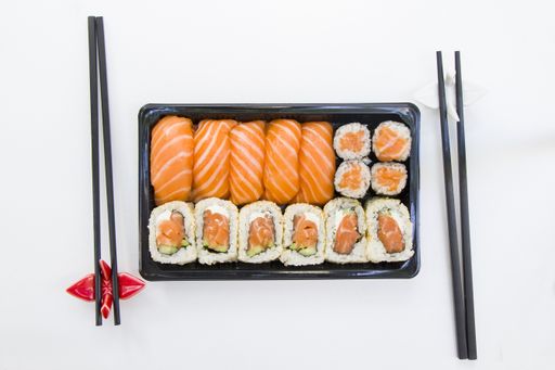 A top view shot of California sushi rolls on a white table cloth