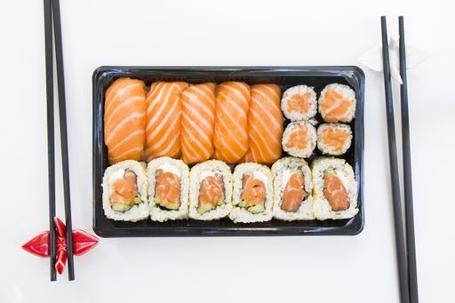 A top view shot of California sushi rolls on a white table cloth