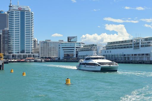 View of Fullers catamaran ferry leaving Auckland downtown terminal
