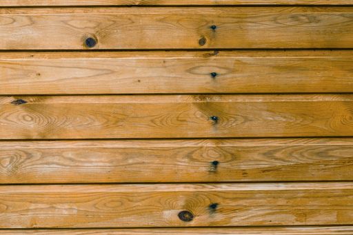 A closeup of empty textured wooden wall background