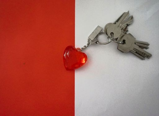 A top view of keys with a keychain with a heart