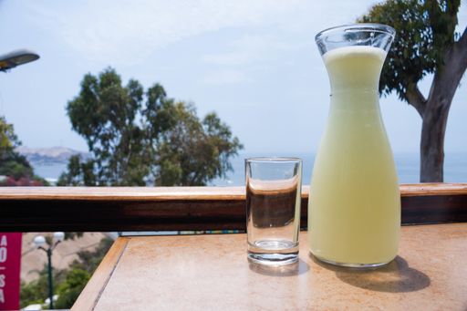 A jar of Frozen lemonade and a glass