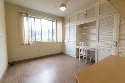 A room interior with desk and wardrob