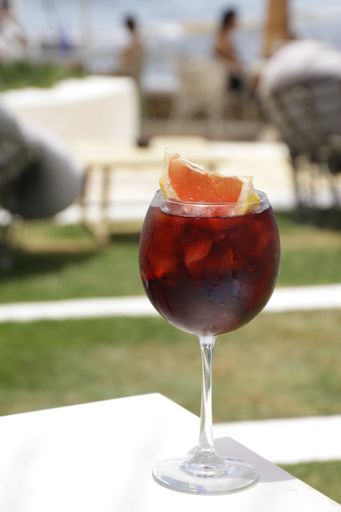 A closeup shot of sangria in a wineglass