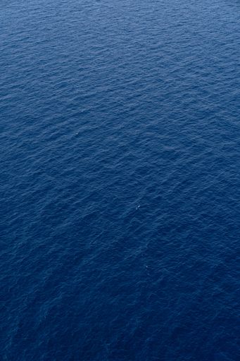 Vertical shot of blue surface of the Mediterranean Sea