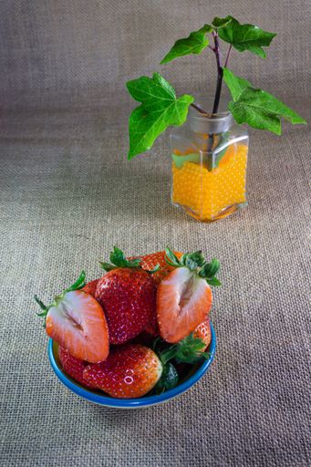 A vertical shot of strawberries in the bowl