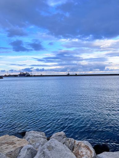 This is a stock photo of a ferry in front of the sea
