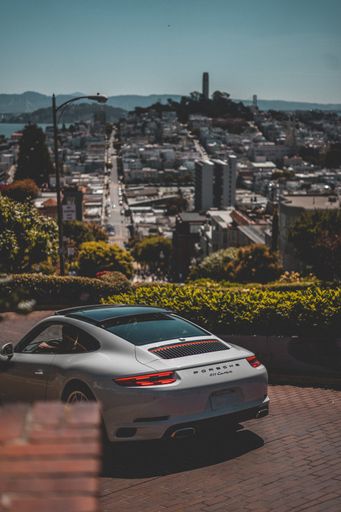 A car driving down the Lomard Street in San Francisco.