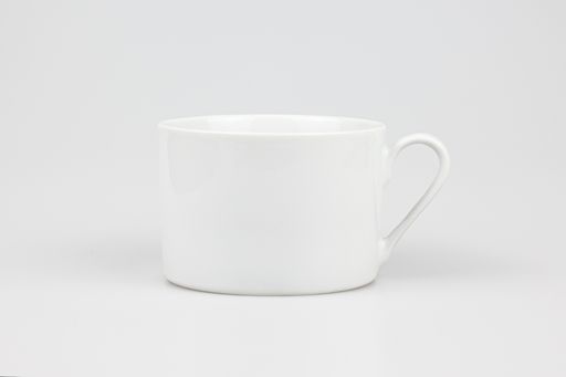 A closeup shot of a ceramic white mug isolated on the white background