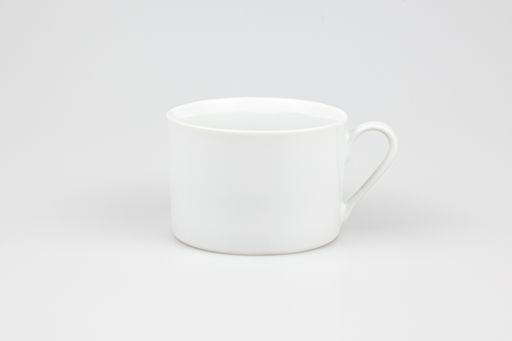 A closeup shot of a ceramic white mug isolated on the white background