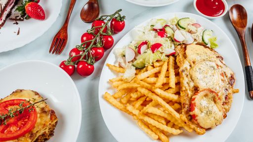 An overhead shot of a table of delicious dishes and dessert