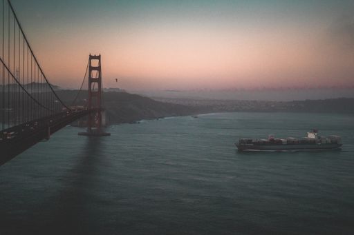 An aerial shot of the Golden Gate bridge during a beautiful sunset