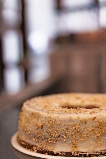 A selective focus shot of an appetizing cake decorated with walnuts