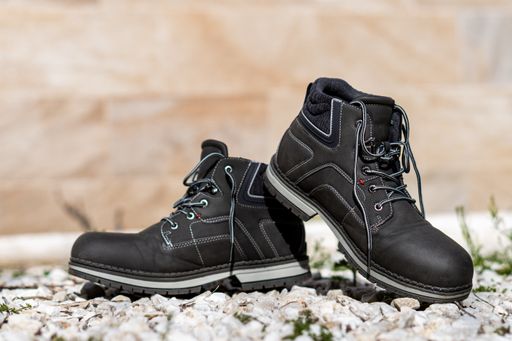 A selective focus of black boots foe men
