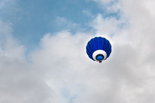 A low angle shot of a flying  air balloon in the air during a festival in Igualada, Barcelona, Catalonia