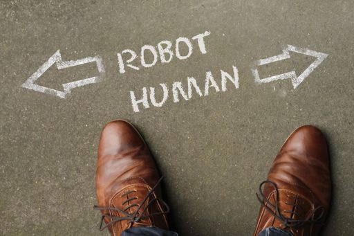 A high angle shot of robot and human marked with opposite directions on the ground